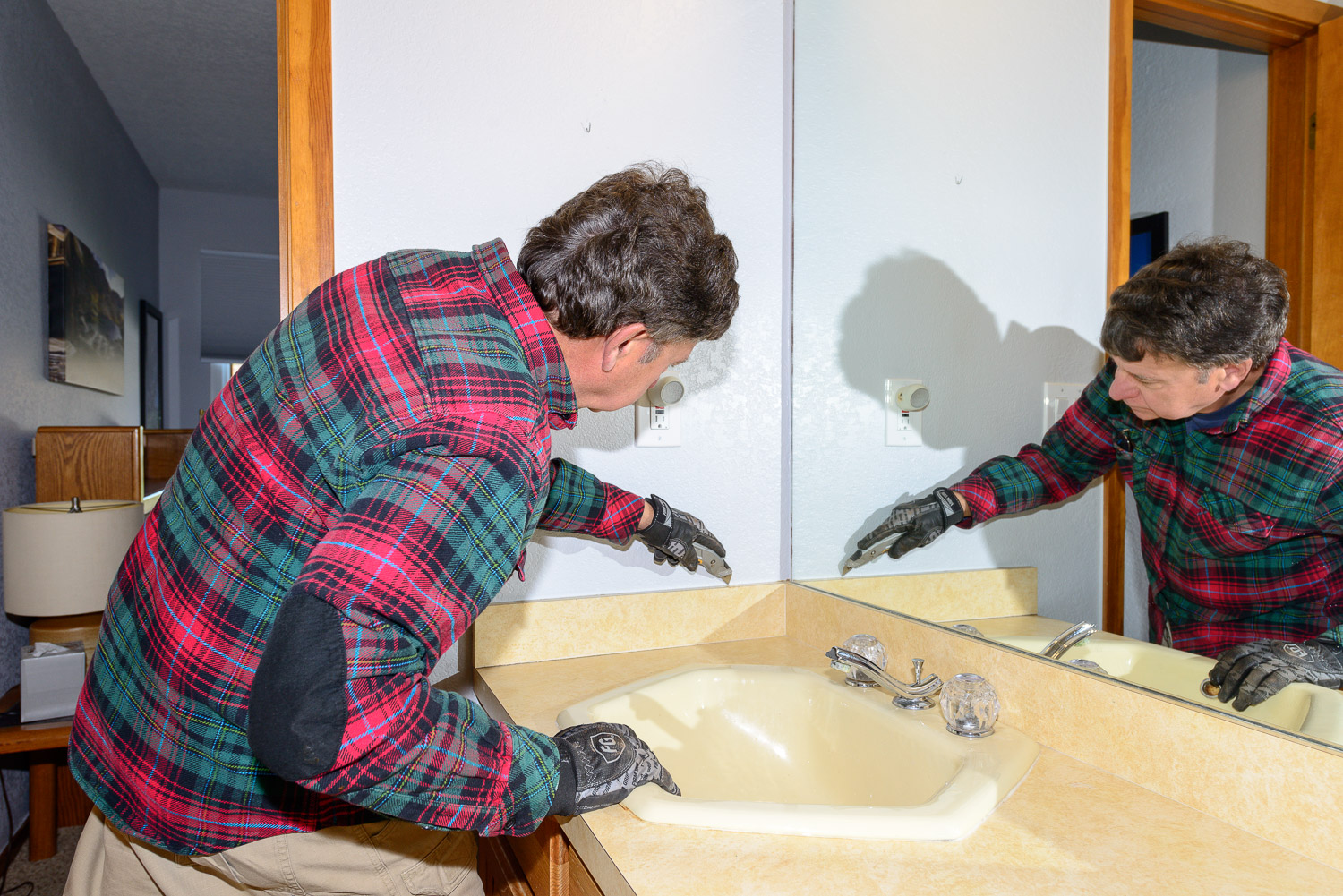 Score all the caulked areas with a razor knife so the top layer of drywall doesn't get ripped off along with the trim.